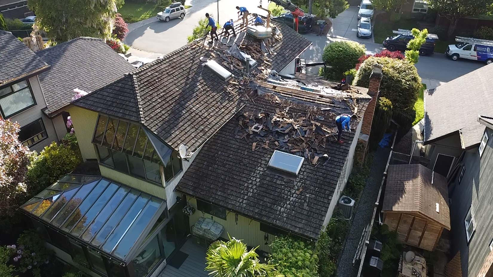 Professional contractors working in a roof repair in Langley,